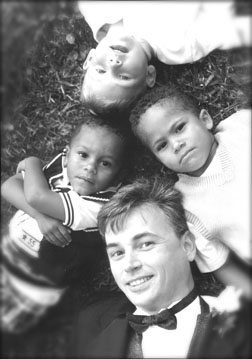 groom on ground surrounded by nephews Photojournalism, destination travel photographer, sensitity, details, silent witness, unobtrusive, creative spirit