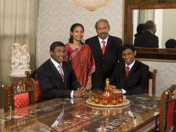 photographer who respects Indian heritage, Indian family around traditional Indian dining room, in home portrait