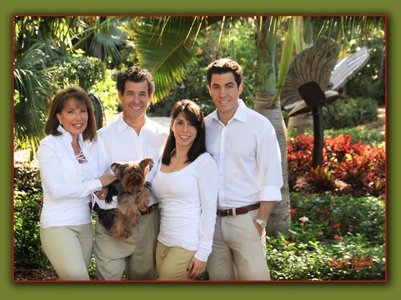 Family portrait in garden with sculpture